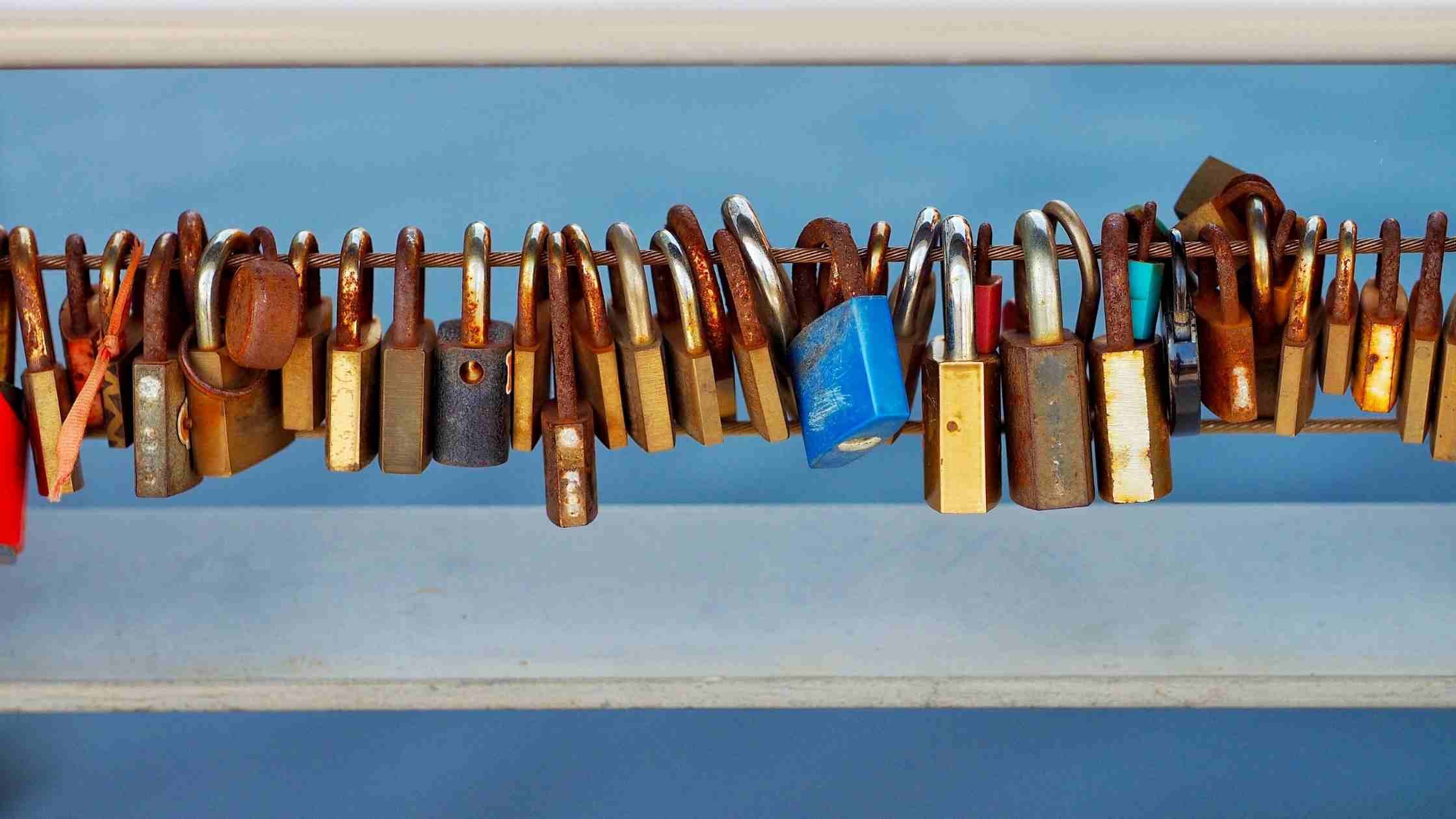 API security concept; collection of rusty padlocks on a wire