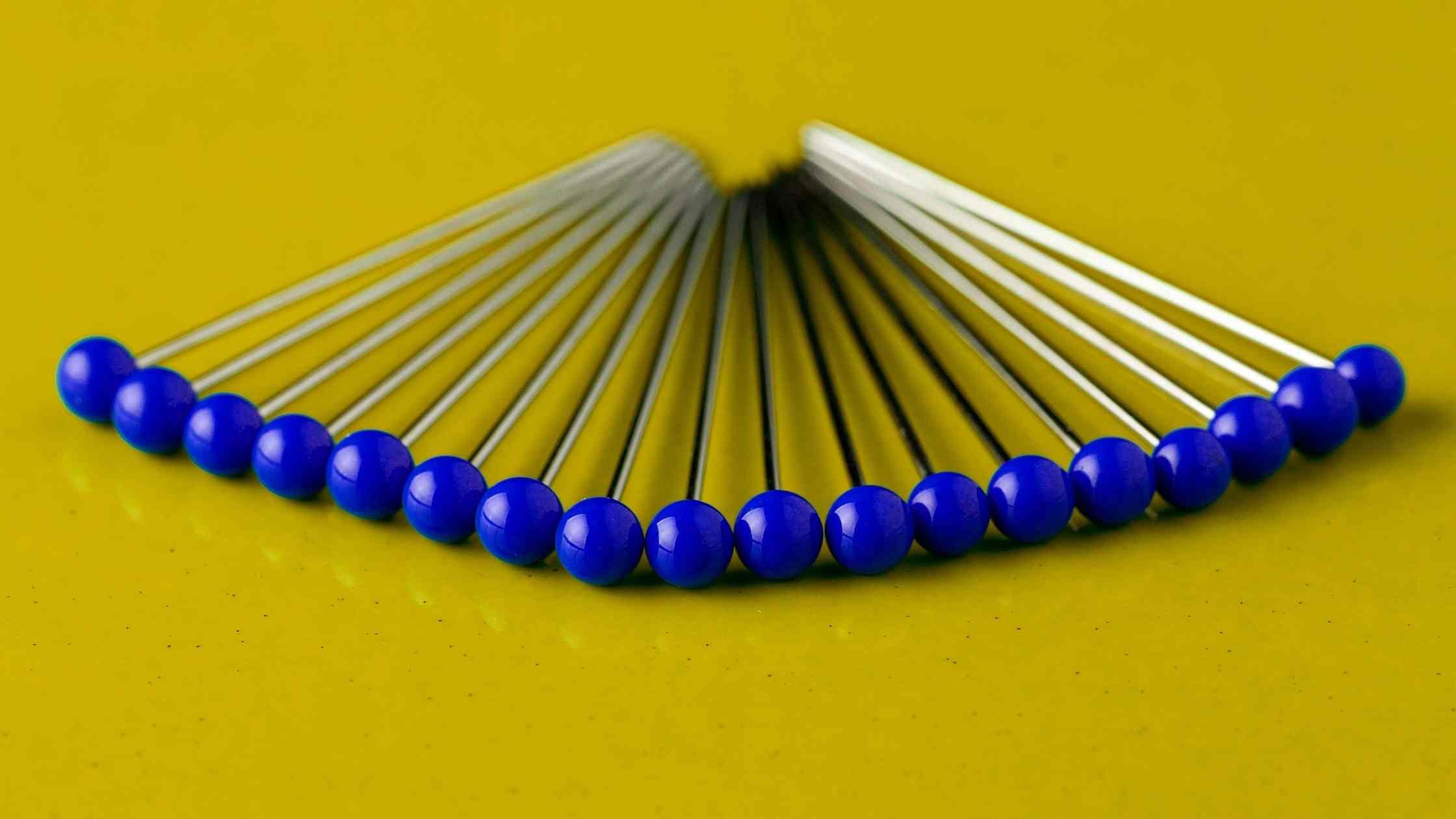 Blue pins on a yellow background