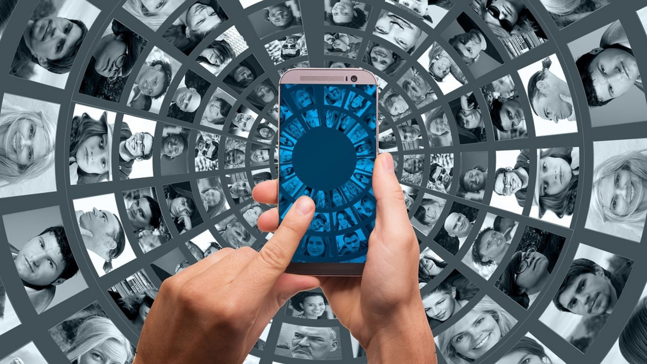 Dating app concept; person using mobile phone, multiple images of people arranged in circles in background