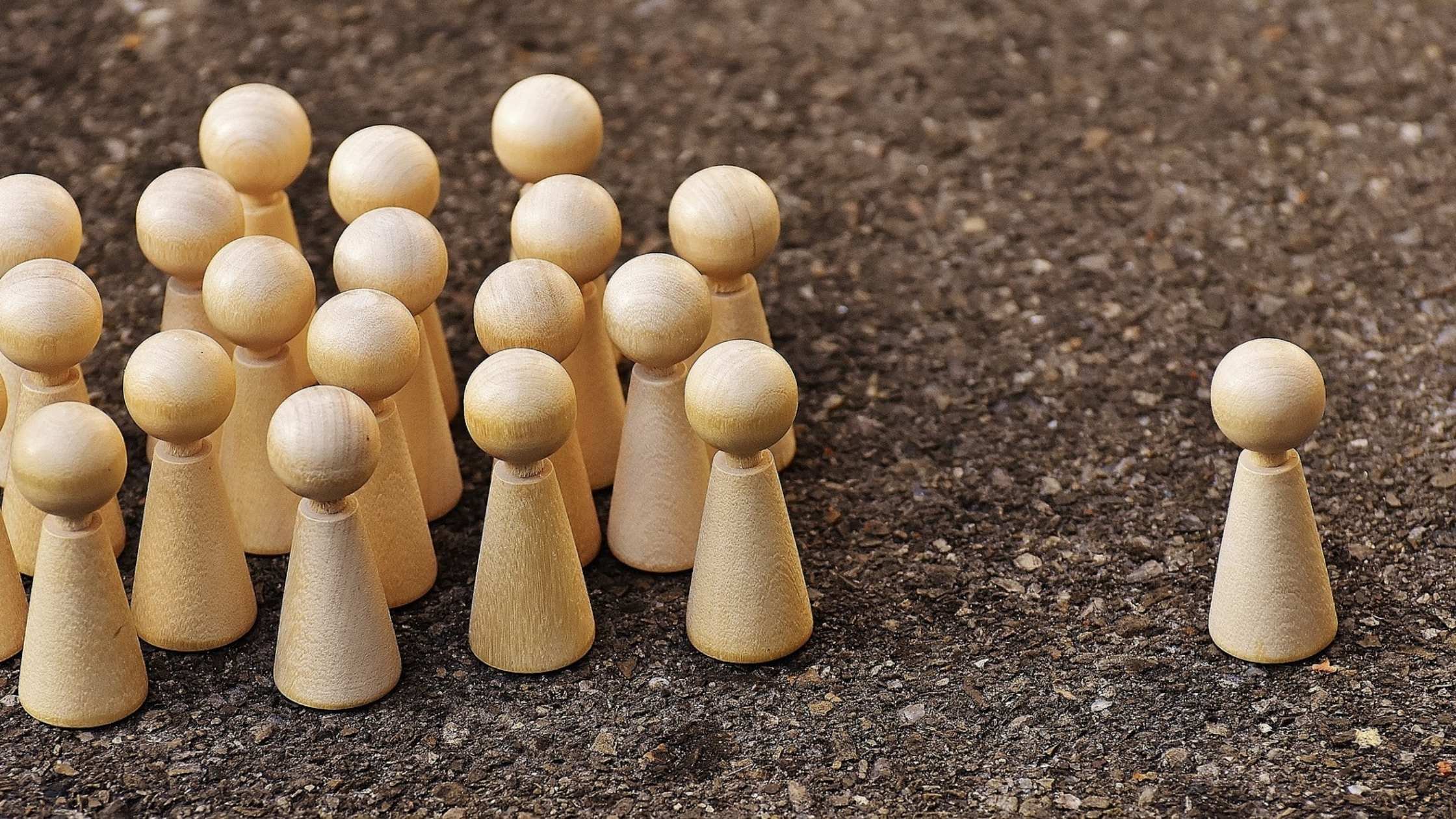 Group of people represented by wooden figures