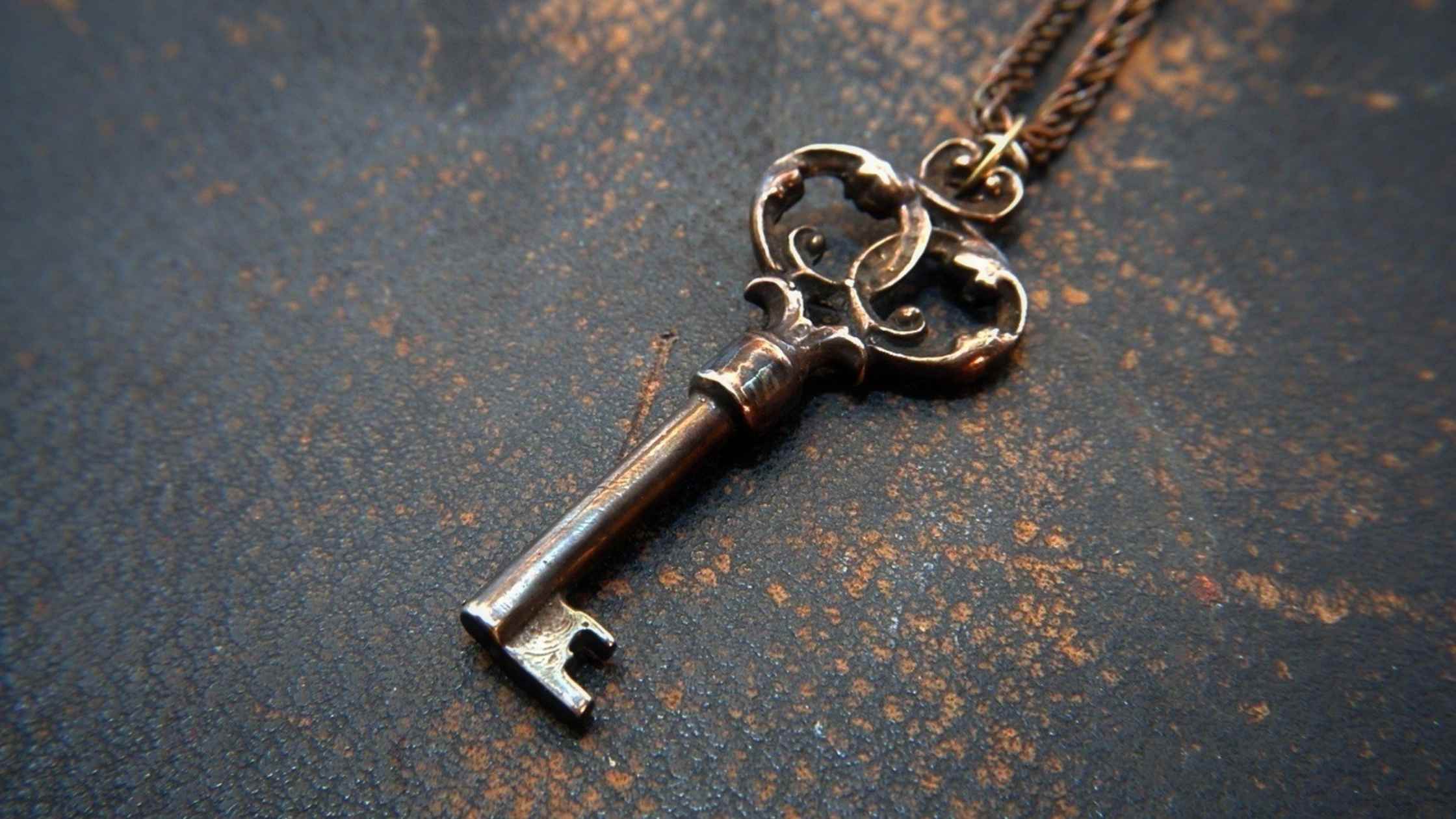Antique iron key on dark background