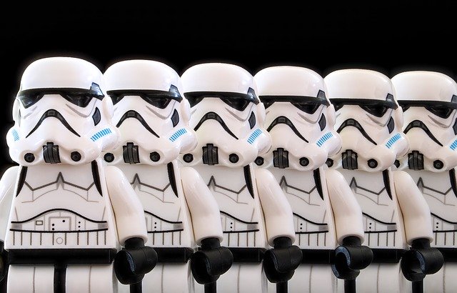 Clone concept; row of Lego stormtrooper figures against black background