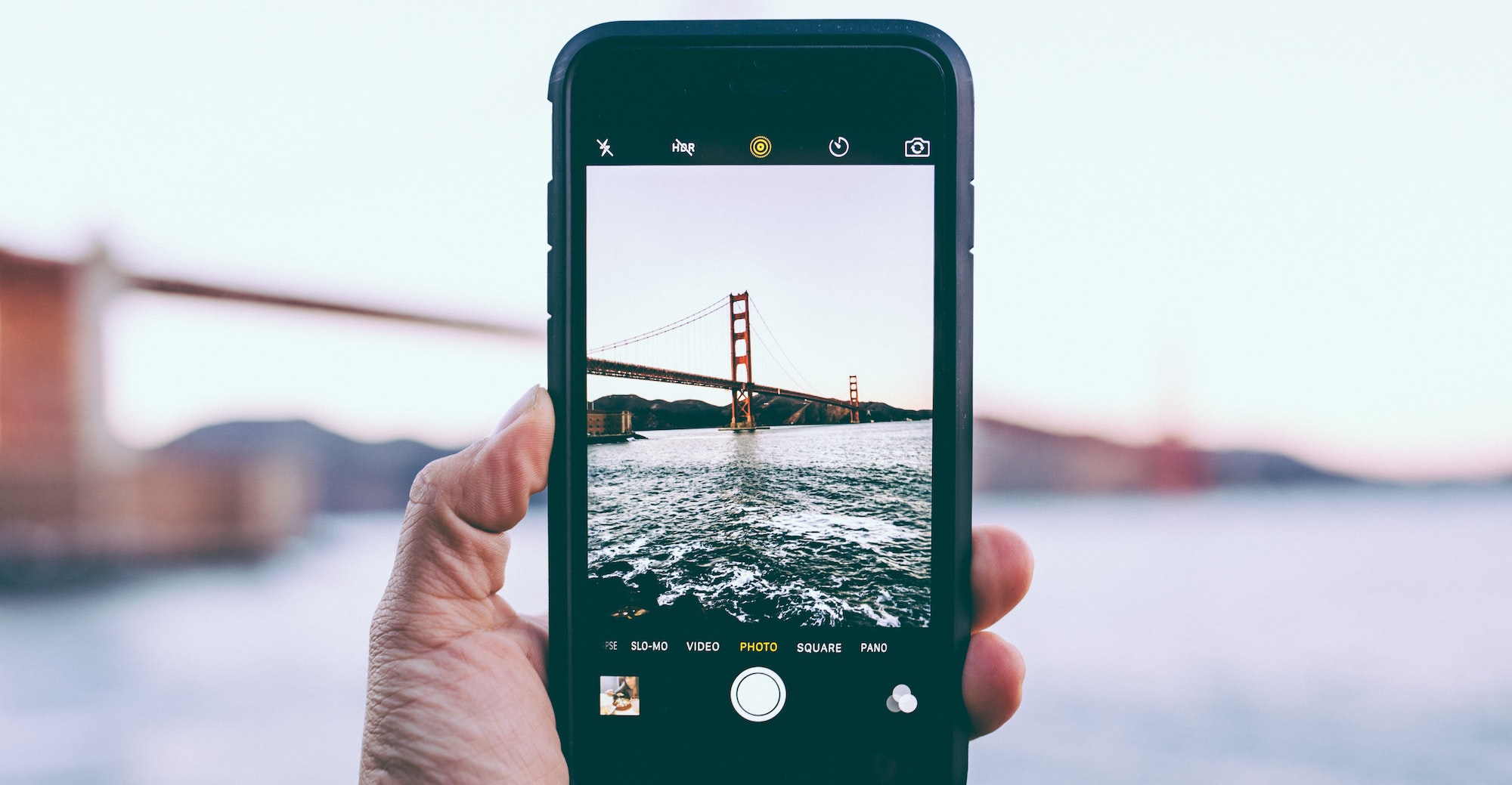 Mobile screen of taking a photo of golden bridge image